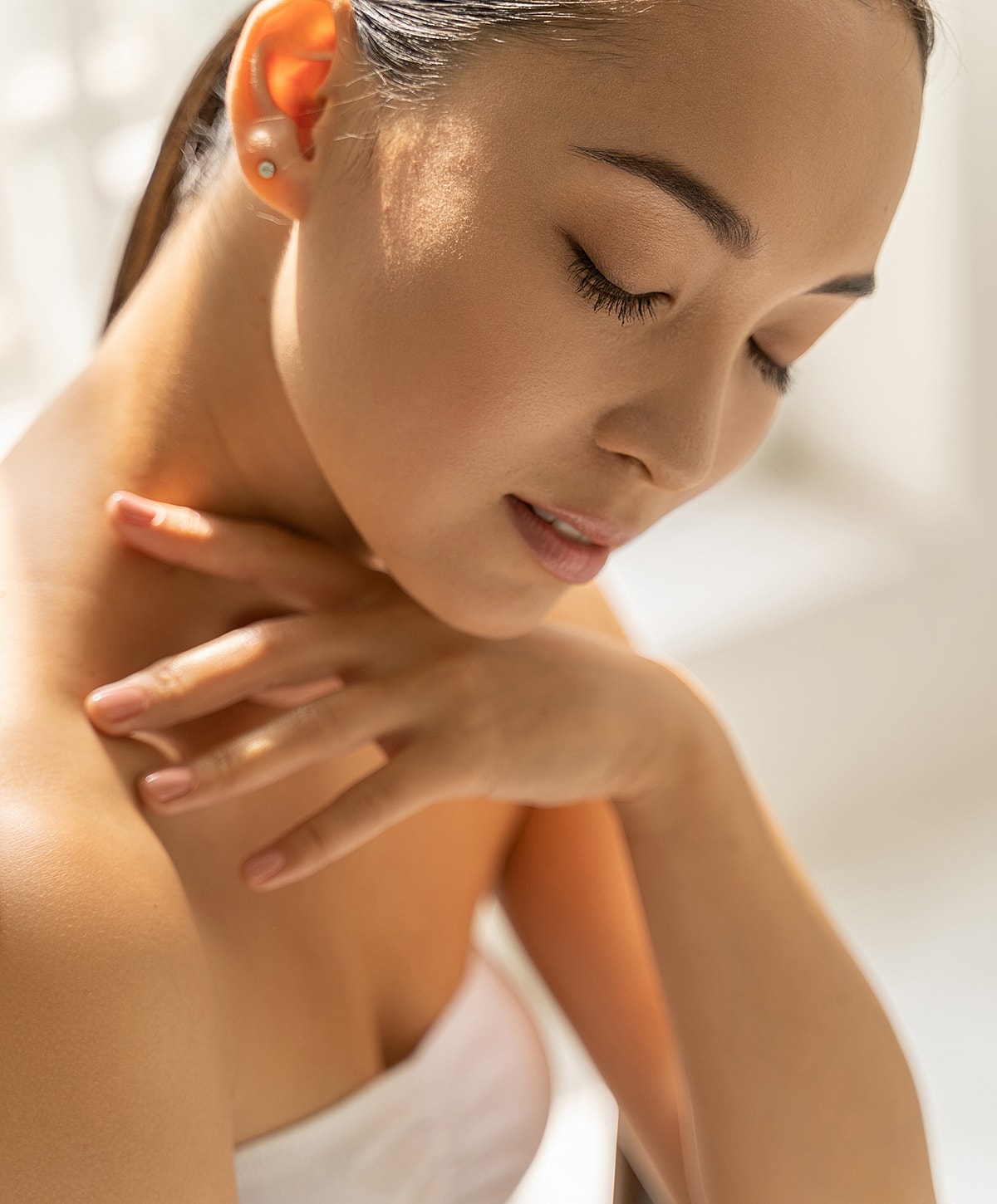 Woman with closed eyes, gentle and serene expression.